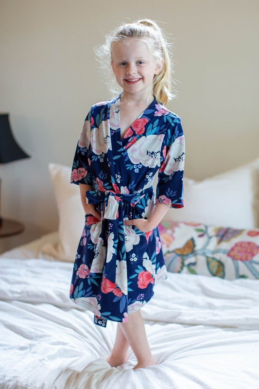 Annabelle printed girl's robe. Perfect big sister gift to match with mommy and newborn. Annabelle print; navy background with cream and red flowers.  