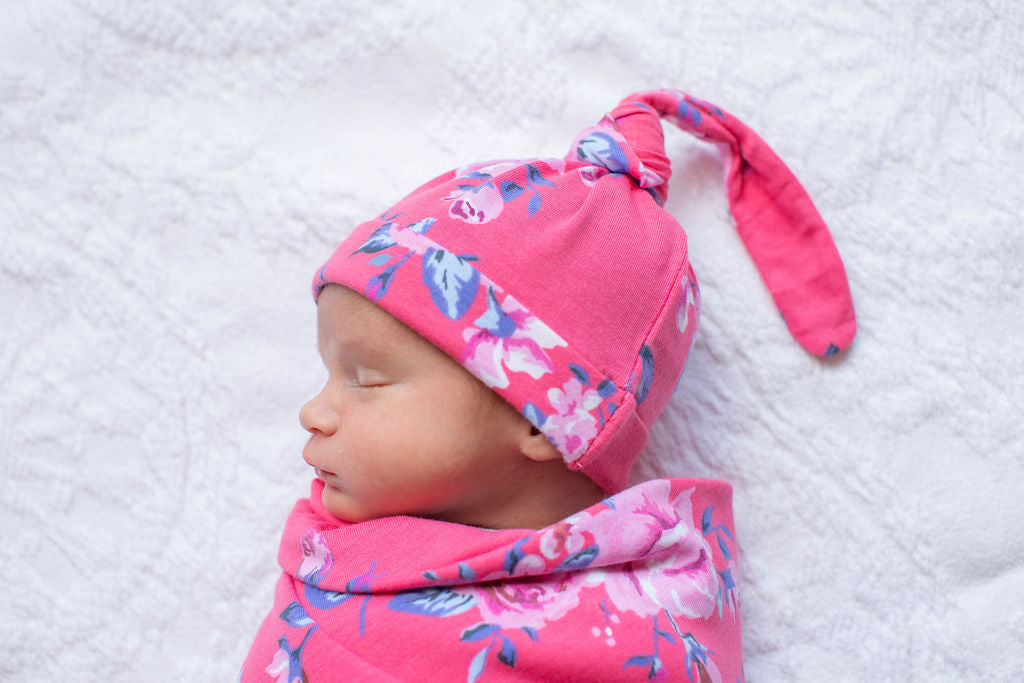 Rose swaddle and knotted hat. 