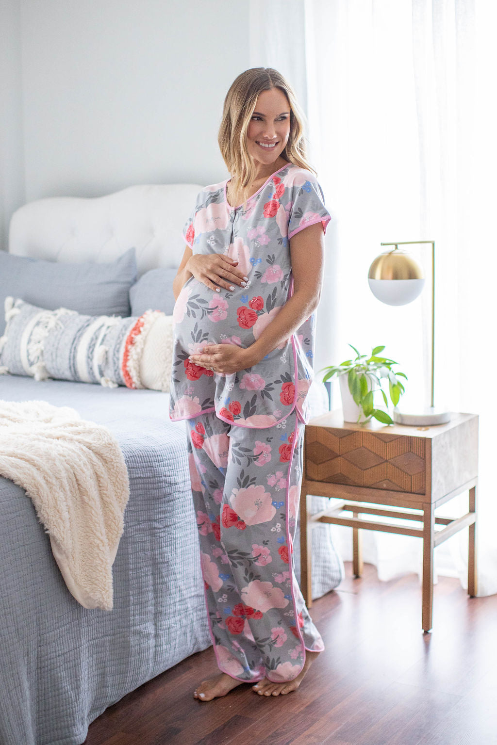 Sophie print with pint and red flowers against a grey background. Pink trim along dolphin hem. Maternity pajamas for mom with easy front snaps for breastfeeding baby. Perfect for pre and post pregnancy.