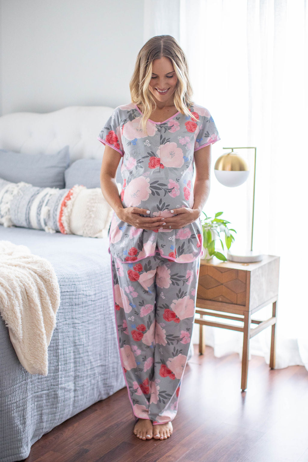 Sophie print with pint and red flowers against a grey background. Pink trim along dolphin hem. Maternity pajamas for mom with easy front snaps for breastfeeding baby. Perfect for pre and post pregnancy.